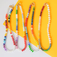 Load image into Gallery viewer, Colorful beaded necklaces on a yellow background

